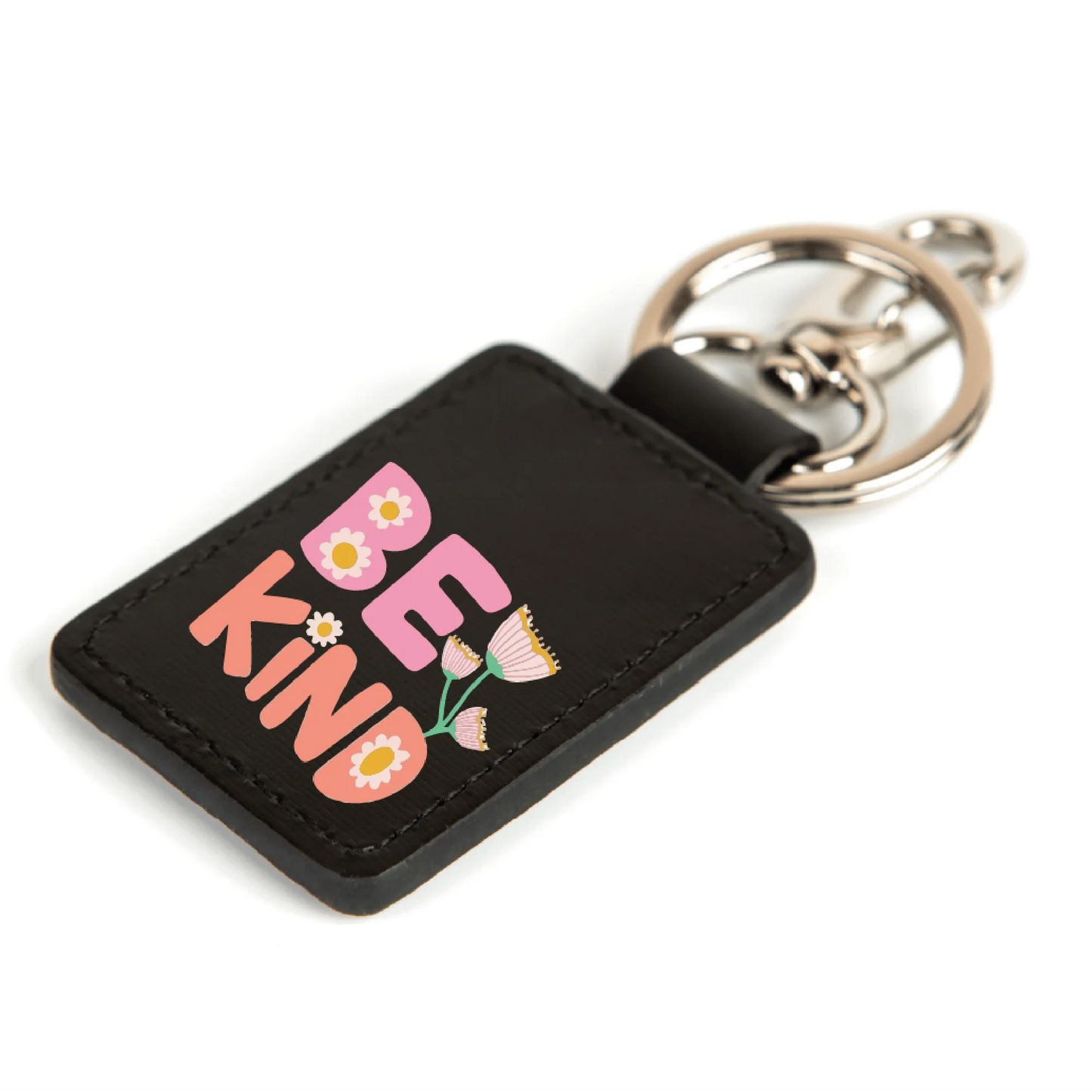 a black key chain with a pink flower on it