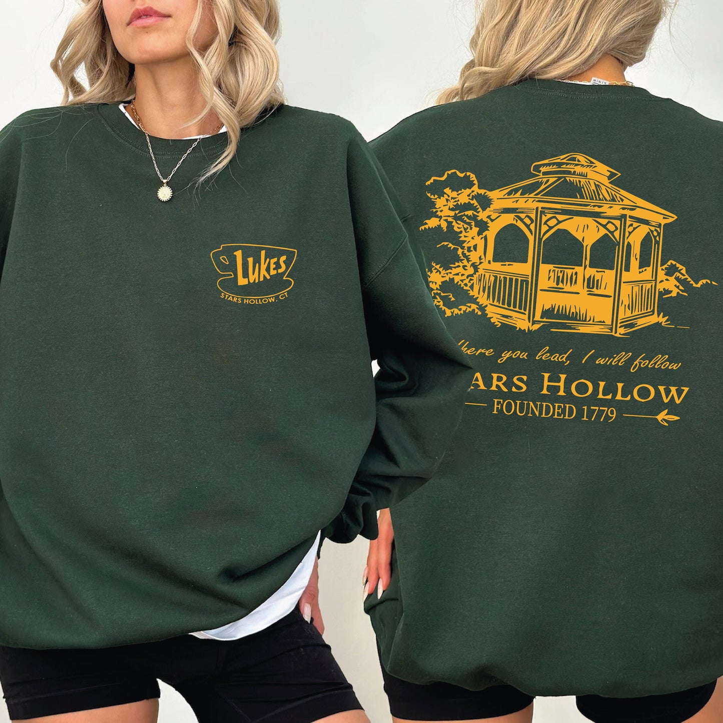 a woman wearing a green sweatshirt with a stars hallow