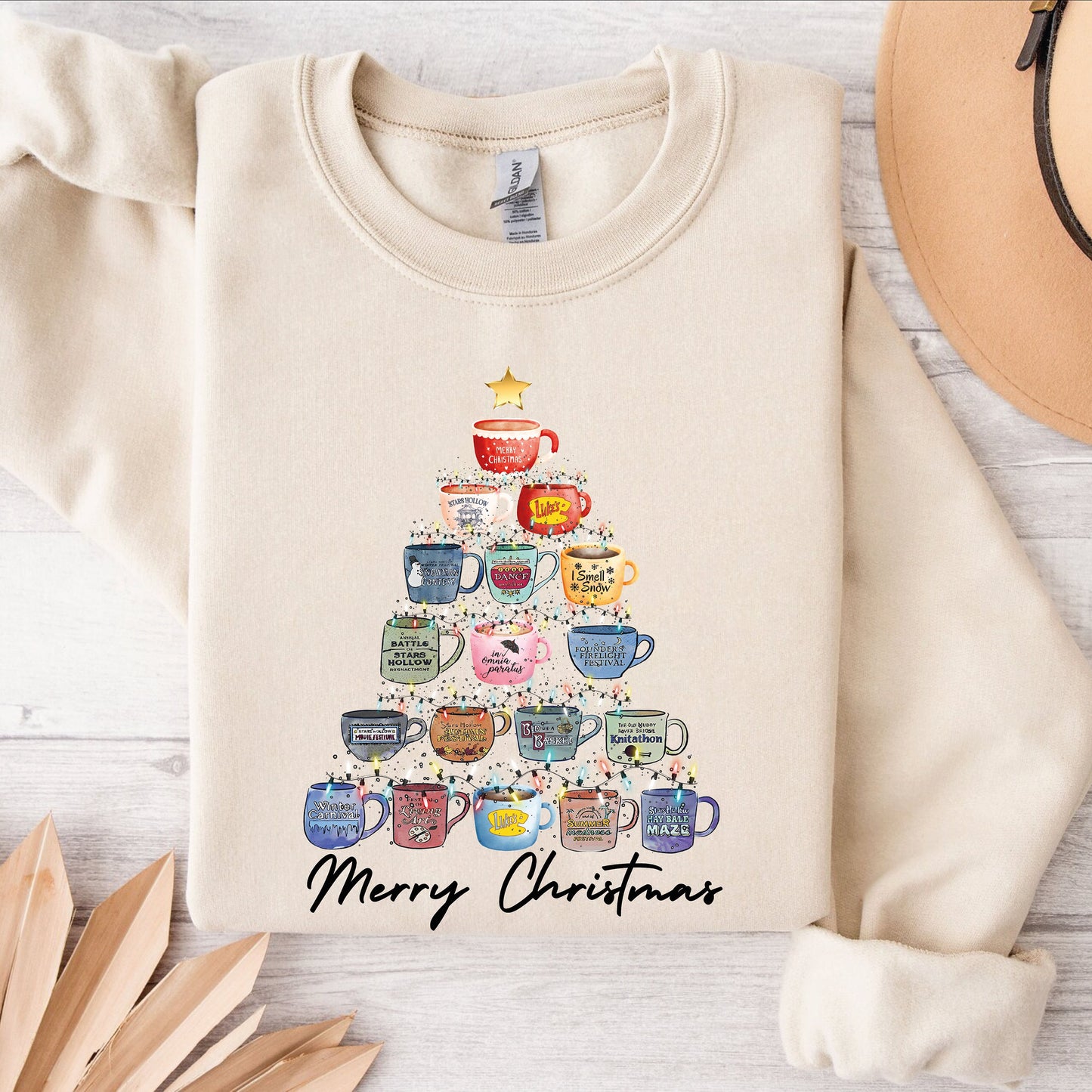 a sweater with a christmas tree stars hallow design on it