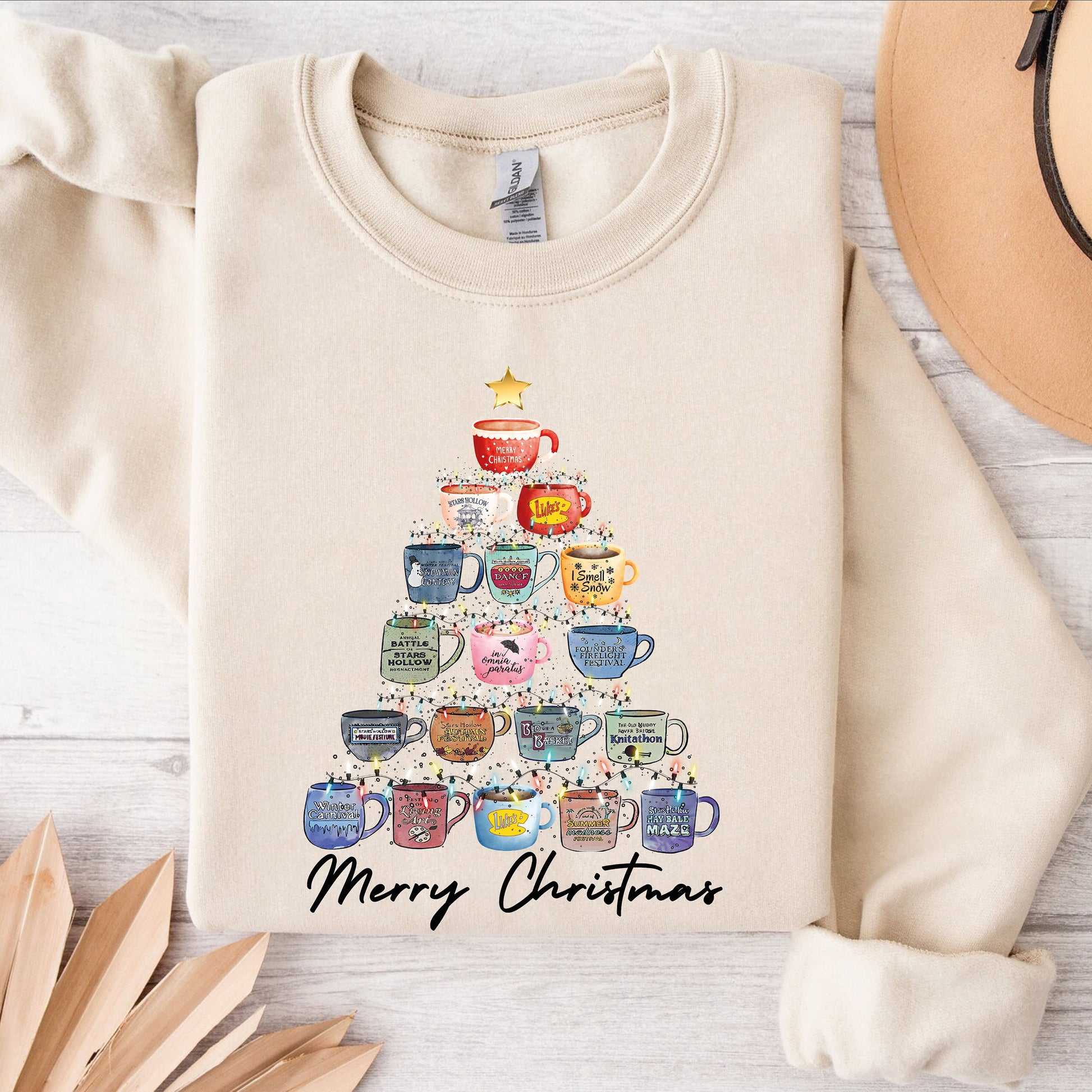 a sweater with a christmas tree stars hallow design on it