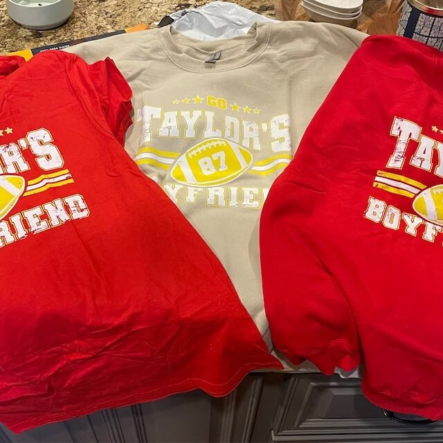 a couple of shirts sitting on top of a counter