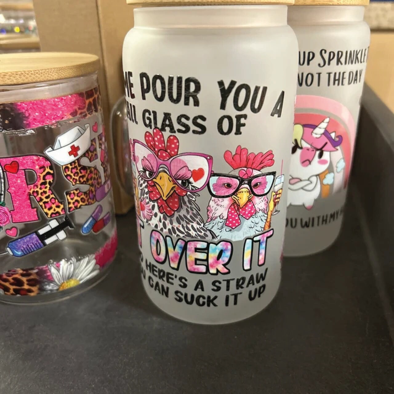 a close up of three plastic cups on a table